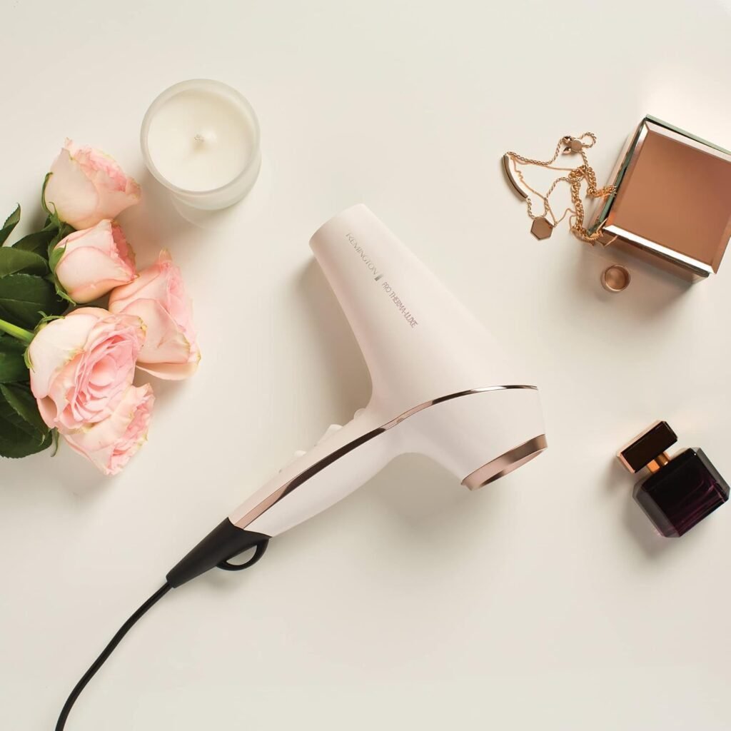 Secador de pelo Remington PROluxe con tecnología OPTIHeat e iónica, diseño elegante color oro rosado, ideal para un secado profesional y duradero en casa.