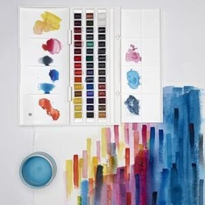Imagen del set de acuarelas Winsor and Newton Cotman de 45 medias godets; incluye paleta de plástico compacta, colores surtidos y pincel, ideal para estudios y artistas principiantes.