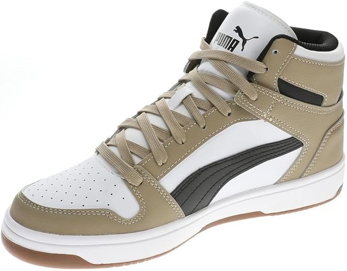 Zapatillas unisex Puma St Runner en vista lateral, diseño moderno en tonos neutros y logo característico de Puma, ideales para estilo urbano y confort diario.