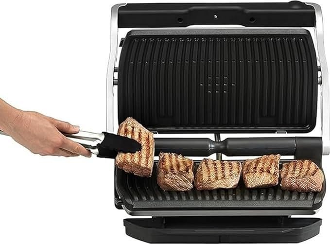 "Descubre nuestra plancha Tefal Optigrill+ XL GC722D16, con 9 programas de cocción y superficie estriada XL. Opiniones reales de clientes satisfechos. ¡Cocina fácil y rápido con indicador de cocción!"